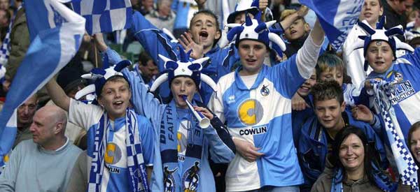 Bristol Rovers Supporters with eccentic headgear during the Johnstone's Paint Trophy Final in 2007. This was played at the Millennium Stadium in Cardiff.