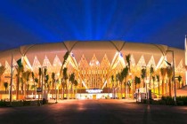 Nightime exterior view of King Abdullah Stadium